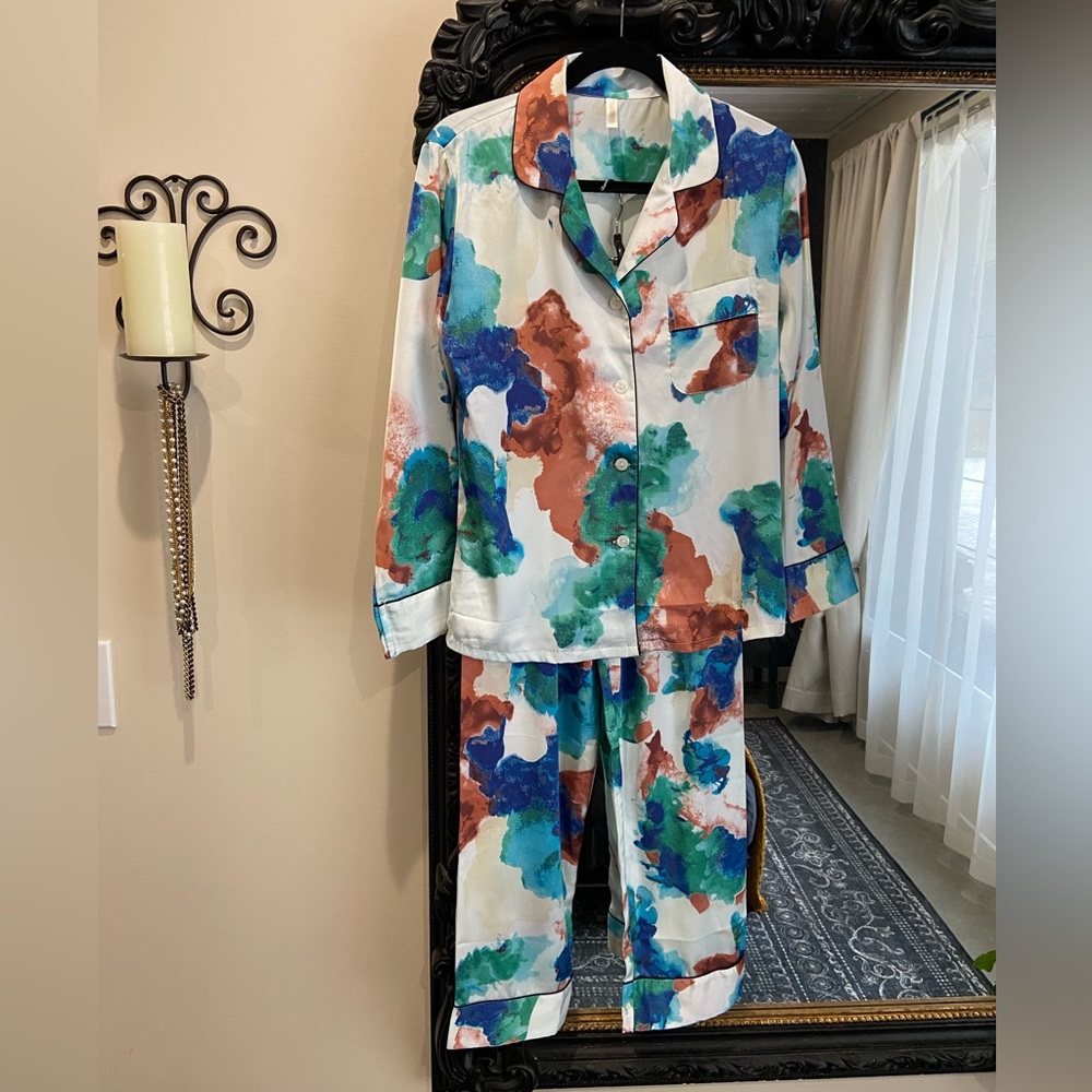 Two piece, satin, multi coloured outfit, with black piping.